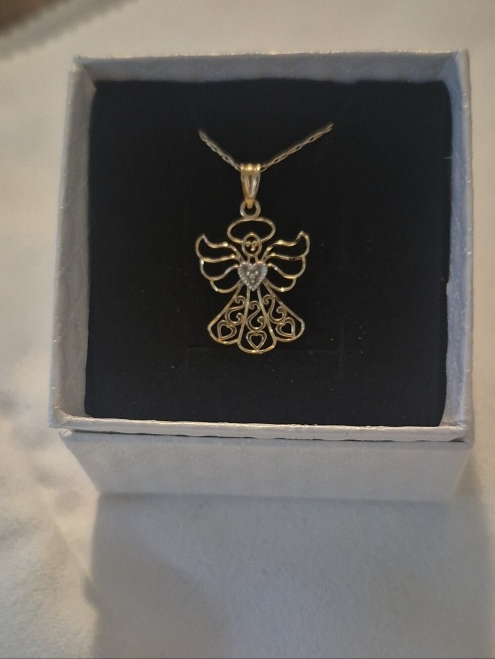 10K solid gold angel pendant on a 10k solid gold chain